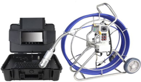 Technician performing borescope inspection inside industrial piping system using articulating videoscope