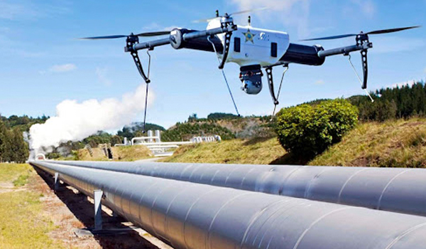 Drone performing inspection survey on offshore oil and gas platform structure