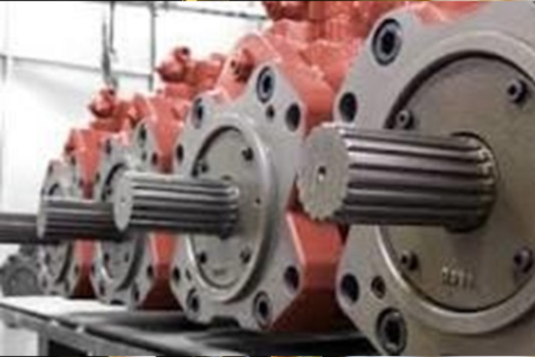 Technician performing industrial machine lubrication and oil system maintenance in a factory environment