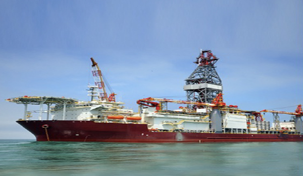 Engineers performing integration acceptance testing on offshore drilling rig systems