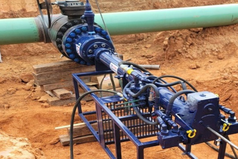 Pipeline intervention specialists performing online welding and hot tapping operations on live hydrocarbon lines