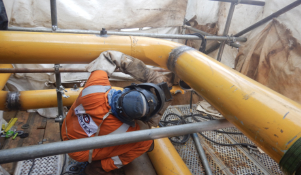 Pipe spool fabrication and installation activities on oil and gas production facility
