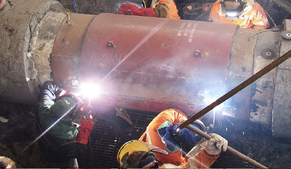 Pipeline welding and construction activities on oil and gas flowline project site