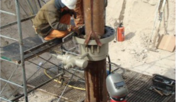 Technicians performing offshore well remediation and wellhead repair operations