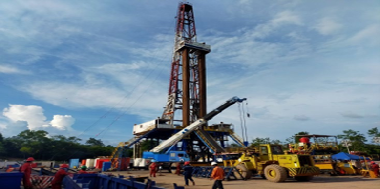 Inspection personnel assessing drilling equipment and well control systems on an operational drilling rig.