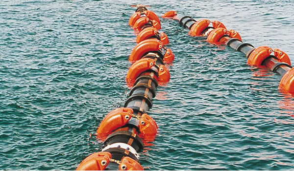 Trelleborg Thor buoyancy modules installed on floating offshore transfer hose systems for marine loading and unloading operations.